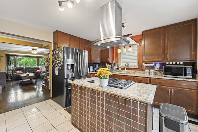 5520 S Kildare Ave, Chicago, IL 60629 - kitchen with stainless steel appliances, island exhaust hood, tasteful backsplash, and a center island