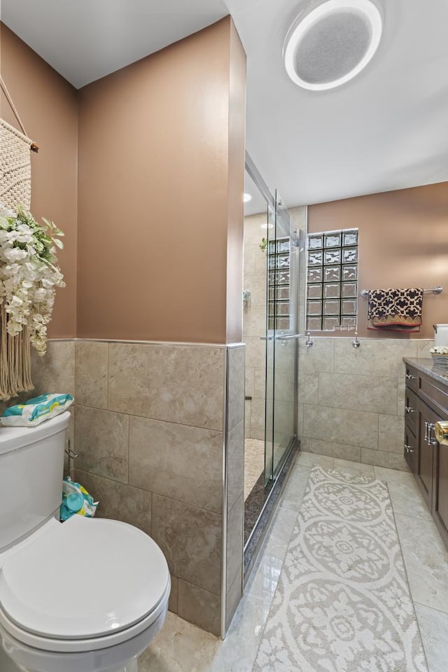 5520 S Kildare Ave, Chicago, IL 60629 - bathroom with tile walls, vanity, a shower stall, a wainscoted wall, and marble finish floors