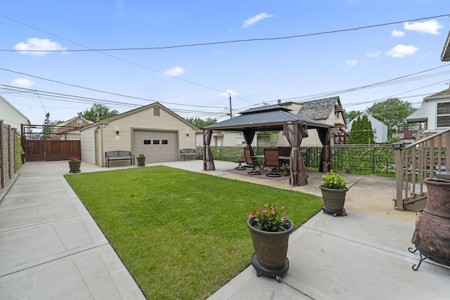 5520 S Kildare Ave, Chicago, IL 60629 - view of yard with a detached garage, a gazebo, a patio area, and an outbuilding