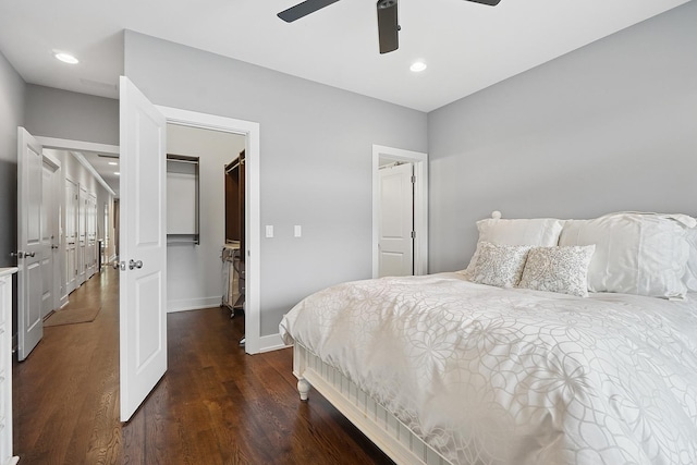 3740 N Kenmore Ave Unit 2, Chicago, IL 60613 - bedroom with a walk in closet, dark wood finished floors, baseboards, a closet, and ceiling fan