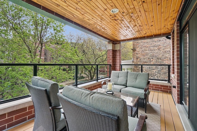 3740 N Kenmore Ave Unit 2, Chicago, IL 60613 - deck featuring an outdoor hangout area and view of wooded area