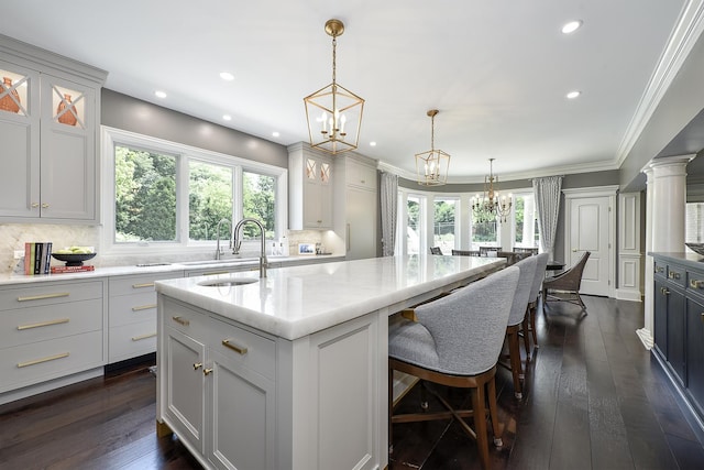 1877 Banbury Rd, Inverness, IL 60067 - kitchen with a chandelier, a kitchen island with sink, tasteful backsplash, plenty of natural light, and recessed lighting