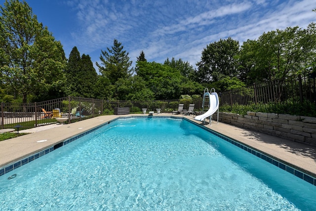 1877 Banbury Rd, Inverness, IL 60067 - view of swimming pool featuring a water slide and a patio area