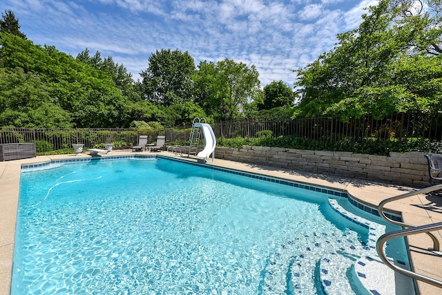1877 Banbury Rd, Inverness, IL 60067 - view of pool with a water slide, a fenced backyard, and a patio area