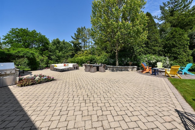 1877 Banbury Rd, Inverness, IL 60067 - view of patio / terrace featuring an outdoor living space with a fire pit, area for grilling, and view of wooded area