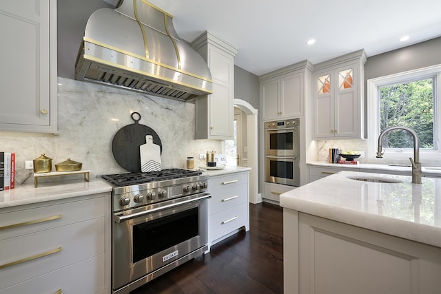 1877 Banbury Rd, Inverness, IL 60067 - kitchen featuring wall chimney range hood, appliances with stainless steel finishes, backsplash, dark wood-style flooring, and recessed lighting