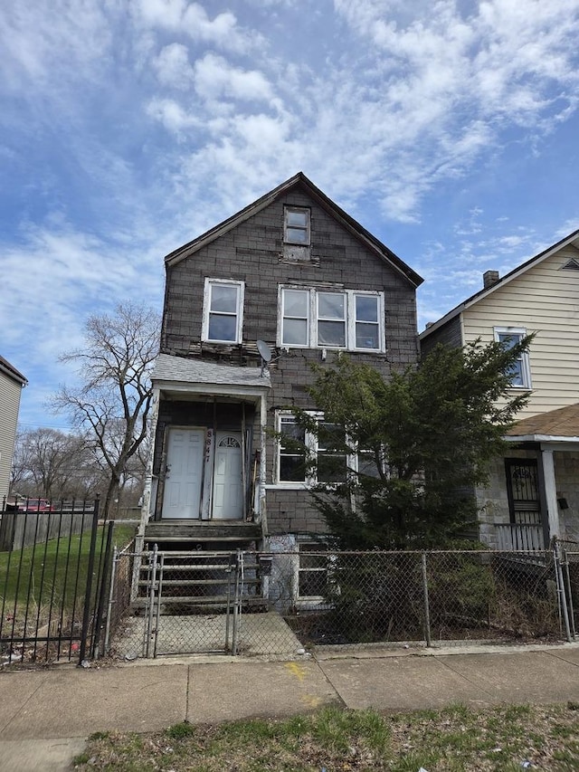 8847 S Burley Ave, Chicago, IL 60617 - view of front of home with a gate and a fenced front yard