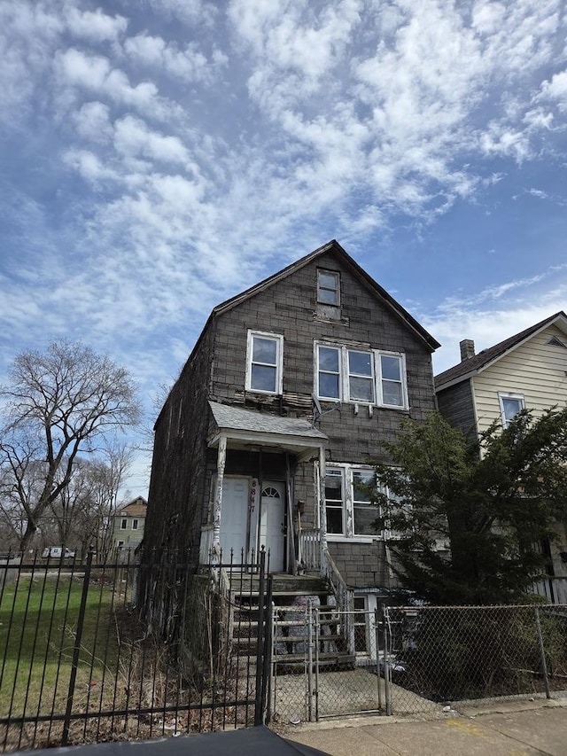 8847 S Burley Ave, Chicago, IL 60617 - view of front facade with a gate and a fenced front yard