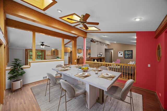 1325 E Lake Ave, Glenview, IL 60025 - dining room featuring ceiling fan, a skylight, wood finished floors, and recessed lighting