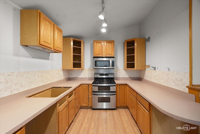 1325 E Lake Ave, Glenview, IL 60025 - kitchen featuring appliances with stainless steel finishes, light wood-style floors, backsplash, light countertops, and open shelves