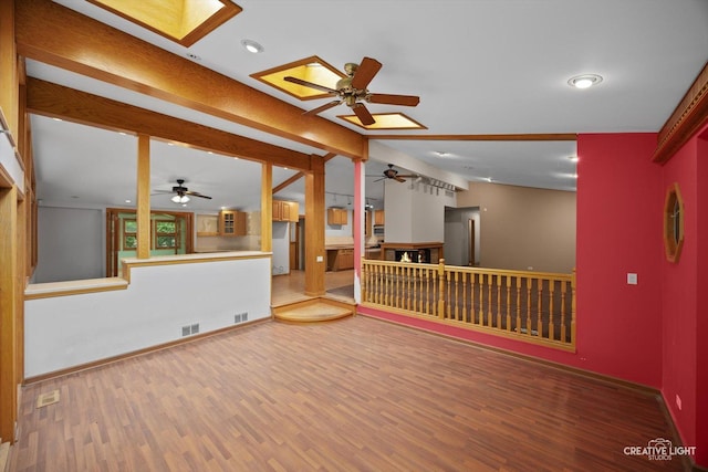 1325 E Lake Ave, Glenview, IL 60025 - unfurnished room with a ceiling fan, a skylight, wood finished floors, and recessed lighting