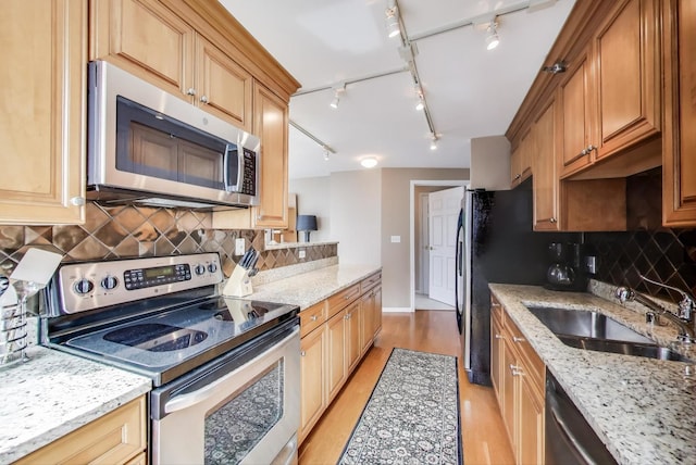 345 N Lasalle Blvd Unit 3904, Chicago, IL 60654 - kitchen with appliances with stainless steel finishes, a sink, backsplash, track lighting, and light wood-type flooring