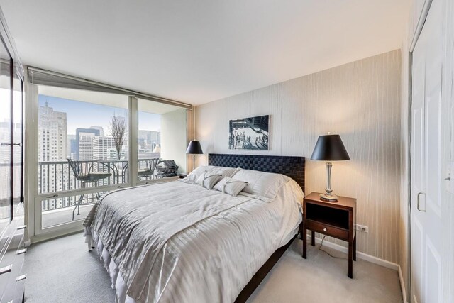 345 N Lasalle Blvd Unit 3904, Chicago, IL 60654 - carpeted bedroom featuring a city view, access to outside, and baseboards