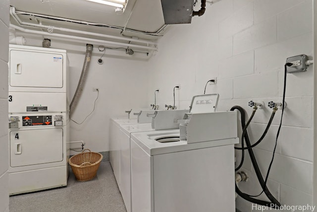 1567 Ridge Ave Unit 401, Evanston, IL 60201 - community laundry room featuring estacked washer and dryer and concrete block wall