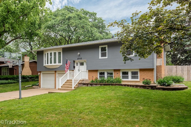 6943 Parkview Dr, Downers Grove, IL 60516 - bi-level home featuring concrete driveway, a garage, and brick siding