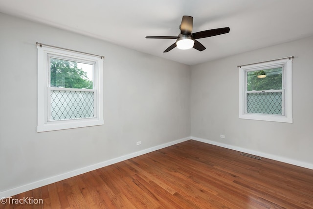 6943 Parkview Dr, Downers Grove, IL 60516 - unfurnished room with wood finished floors and ceiling fan