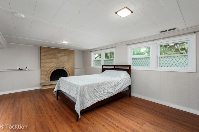 6943 Parkview Dr, Downers Grove, IL 60516 - bedroom with wood finished floors and a fireplace