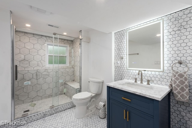 6943 Parkview Dr, Downers Grove, IL 60516 - full bath featuring vanity, tiled shower, tile patterned floors, recessed lighting, and tile walls