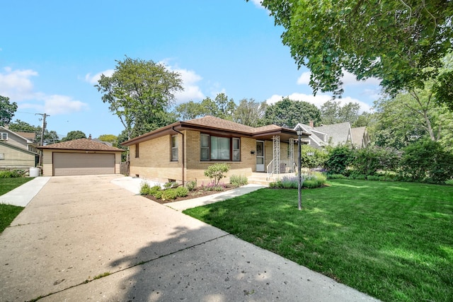 370 N Commonwealth Ave, Elgin, IL 60123 - view of front of home featuring brick siding, an outdoor structure, a front lawn, and a detached garage