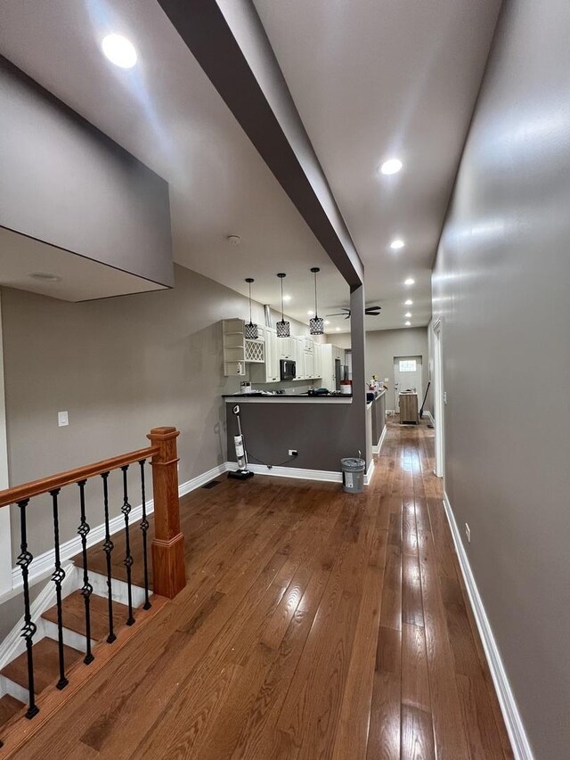 5757 S Aberdeen St, Chicago, IL 60621 - unfurnished living room with dark wood-type flooring and recessed lighting