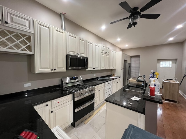 5757 S Aberdeen St, Chicago, IL 60621 - kitchen with stainless steel appliances, a ceiling fan, recessed lighting, and a center island with sink