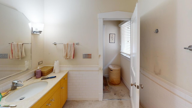 1025 Wesley Ave, Evanston, IL 60202 - bathroom with vanity, tile patterned flooring, and wainscoting