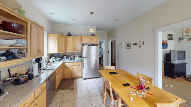 1025 Wesley Ave, Evanston, IL 60202 - kitchen featuring stainless steel appliances, light brown cabinetry, and light countertops