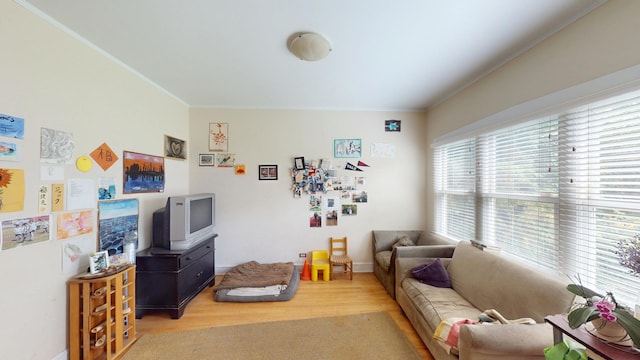 1025 Wesley Ave, Evanston, IL 60202 - living room with crown molding and light wood-style floors