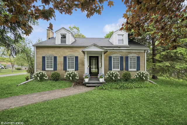 1800 Shermer Rd, Northbrook, IL 60062 - view of front facade featuring brick siding, a front yard, a chimney, and a shingled roof