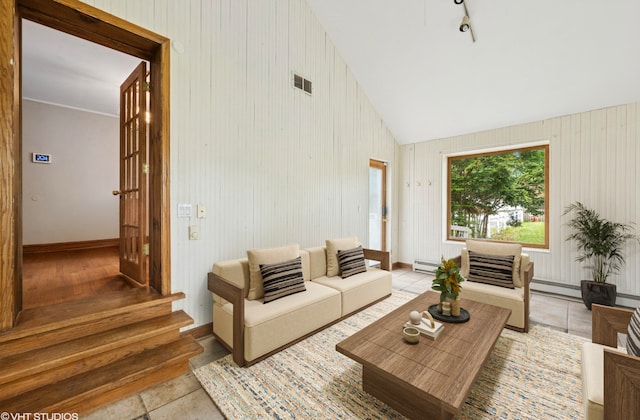 1800 Shermer Rd, Northbrook, IL 60062 - living room with vaulted ceiling, baseboard heating, and stairs