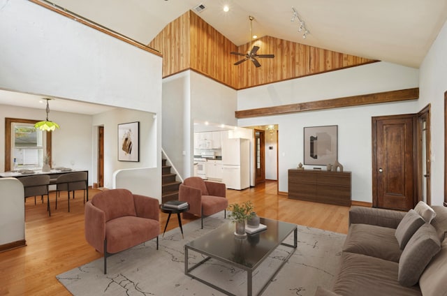 1800 Shermer Rd, Northbrook, IL 60062 - living area with high vaulted ceiling, stairway, light wood-style flooring, and ceiling fan