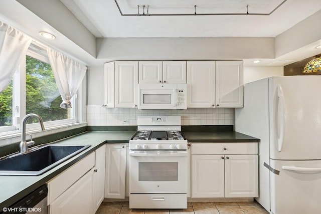 1800 Shermer Rd, Northbrook, IL 60062 - kitchen featuring white appliances, white cabinets, backsplash, dark countertops, and recessed lighting