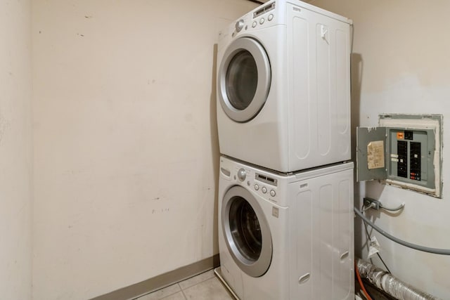 848 Bonita Ave, Elk Grove Village, IL 60007 - laundry room with estacked washer and dryer, electric panel, and light tile patterned floors