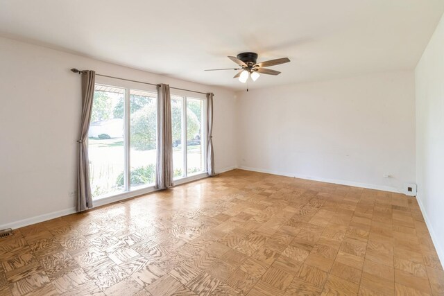 848 Bonita Ave, Elk Grove Village, IL 60007 - spare room with a ceiling fan and baseboards