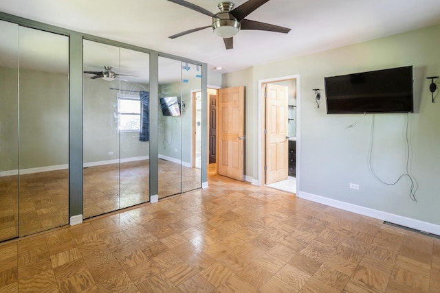 848 Bonita Ave, Elk Grove Village, IL 60007 - unfurnished bedroom featuring multiple closets, ensuite bathroom, and ceiling fan