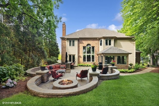 3104 Royal Fox Dr, Saint Charles, IL 60174 - rear view of house with a fire pit, a patio area, a chimney, a lawn, and brick siding