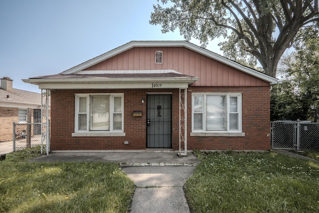 14909 Langley Ave, Dolton, IL 60419 - bungalow with brick siding and a gate