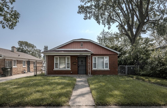 14909 Langley Ave, Dolton, IL 60419 - bungalow featuring brick siding and a gate