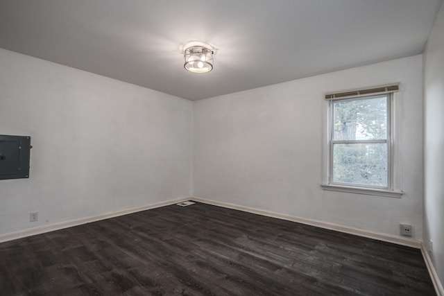14909 Langley Ave, Dolton, IL 60419 - empty room featuring electric panel, dark wood finished floors, and baseboards