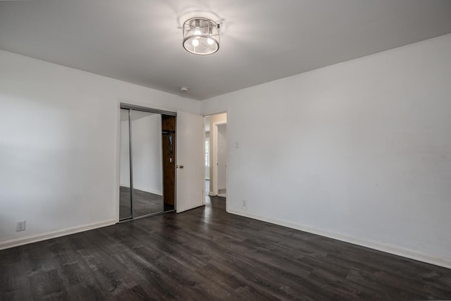 14909 Langley Ave, Dolton, IL 60419 - empty room with dark wood finished floors and baseboards