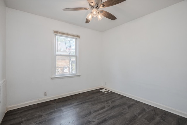 14909 Langley Ave, Dolton, IL 60419 - spare room featuring dark wood finished floors, baseboards, and a ceiling fan