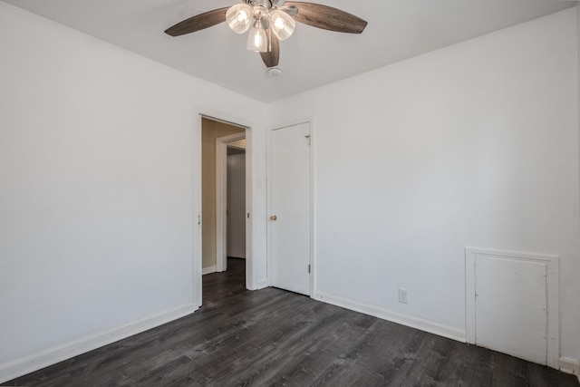 14909 Langley Ave, Dolton, IL 60419 - spare room featuring dark wood-style flooring, a ceiling fan, and baseboards