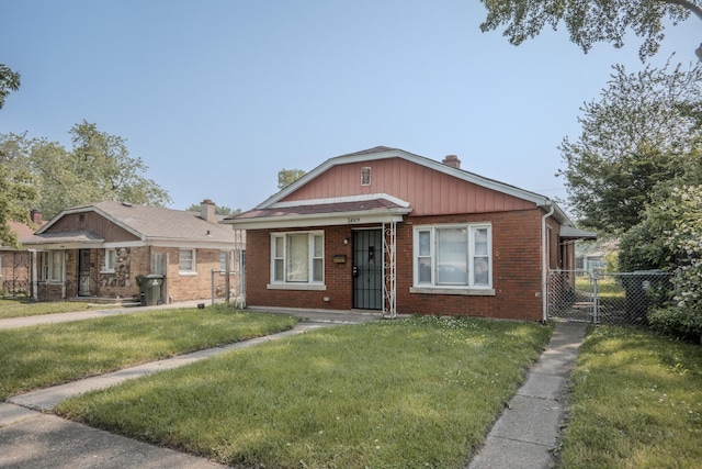 14909 Langley Ave, Dolton, IL 60419 - bungalow-style house with brick siding, a gate, and a chimney