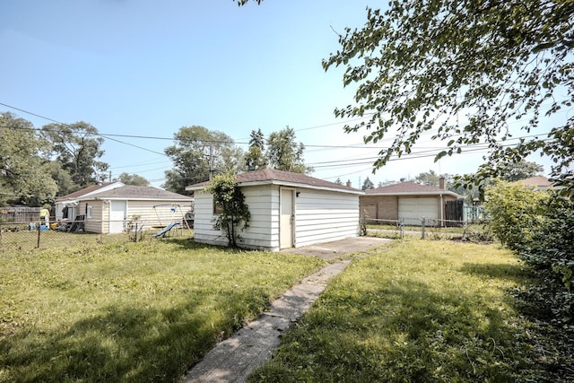 14909 Langley Ave, Dolton, IL 60419 - view of yard featuring an outbuilding and a garage