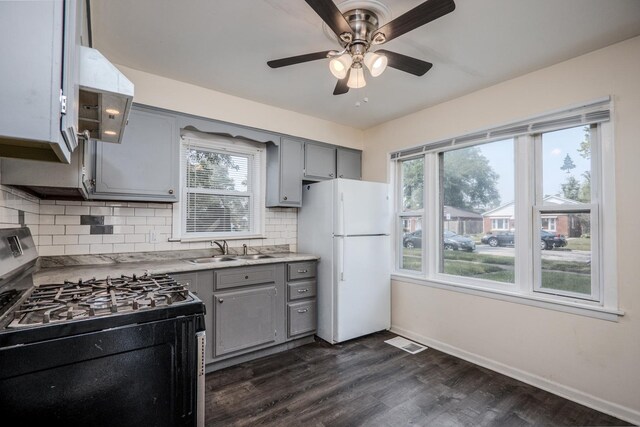 14909 Langley Ave, Dolton, IL 60419 - kitchen with stainless steel gas range, gray cabinetry, freestanding refrigerator, a sink, and a ceiling fan
