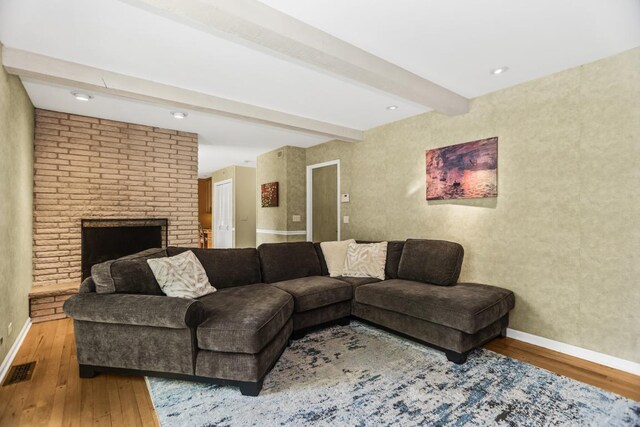 1145 Wincanton Dr, Deerfield, IL 60015 - living room featuring wood finished floors, beam ceiling, a fireplace, and wallpapered walls