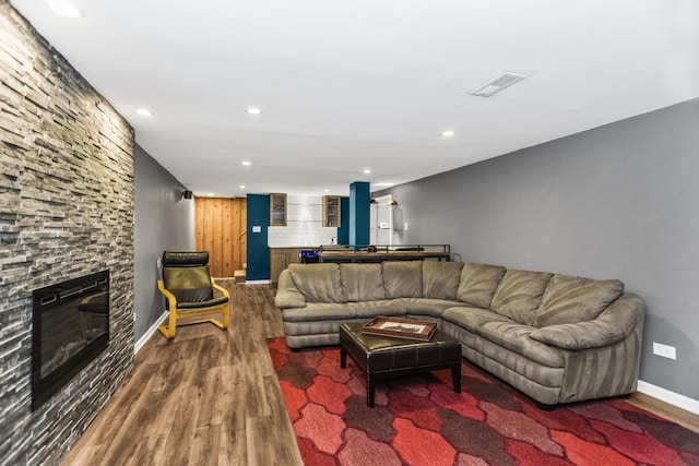 1145 Wincanton Dr, Deerfield, IL 60015 - living room with wood finished floors, recessed lighting, and a stone fireplace