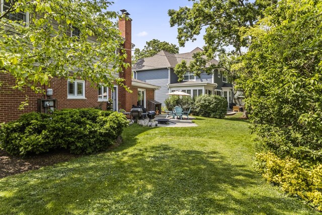 1145 Wincanton Dr, Deerfield, IL 60015 - view of green lawn featuring a patio area
