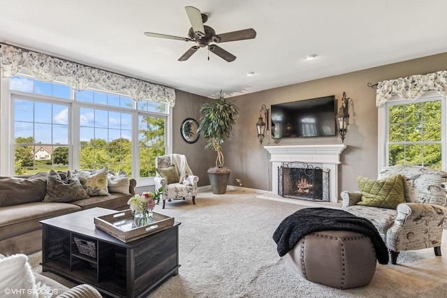 9520 Nicklaus Ln, Crystal Lake, IL 60014 - carpeted living area featuring ceiling fan, healthy amount of natural light, and a warm lit fireplace