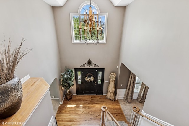 9520 Nicklaus Ln, Crystal Lake, IL 60014 - entryway featuring wood finished floors, a chandelier, and a high ceiling